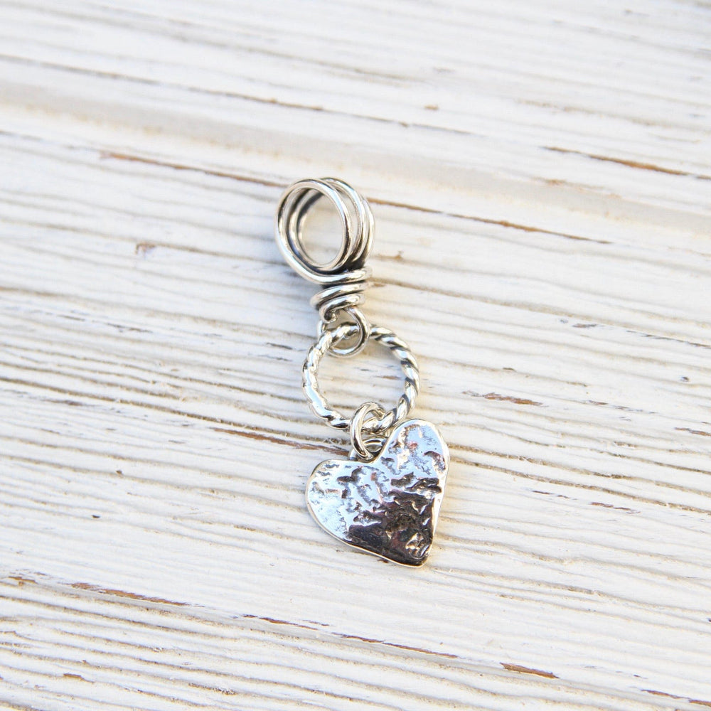 
                      
                        PND Silver Heart on Textured Ring with Vine Bail Pendant
                      
                    