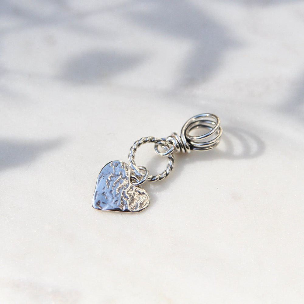 
                      
                        PND Silver Heart on Textured Ring with Vine Bail Pendant
                      
                    