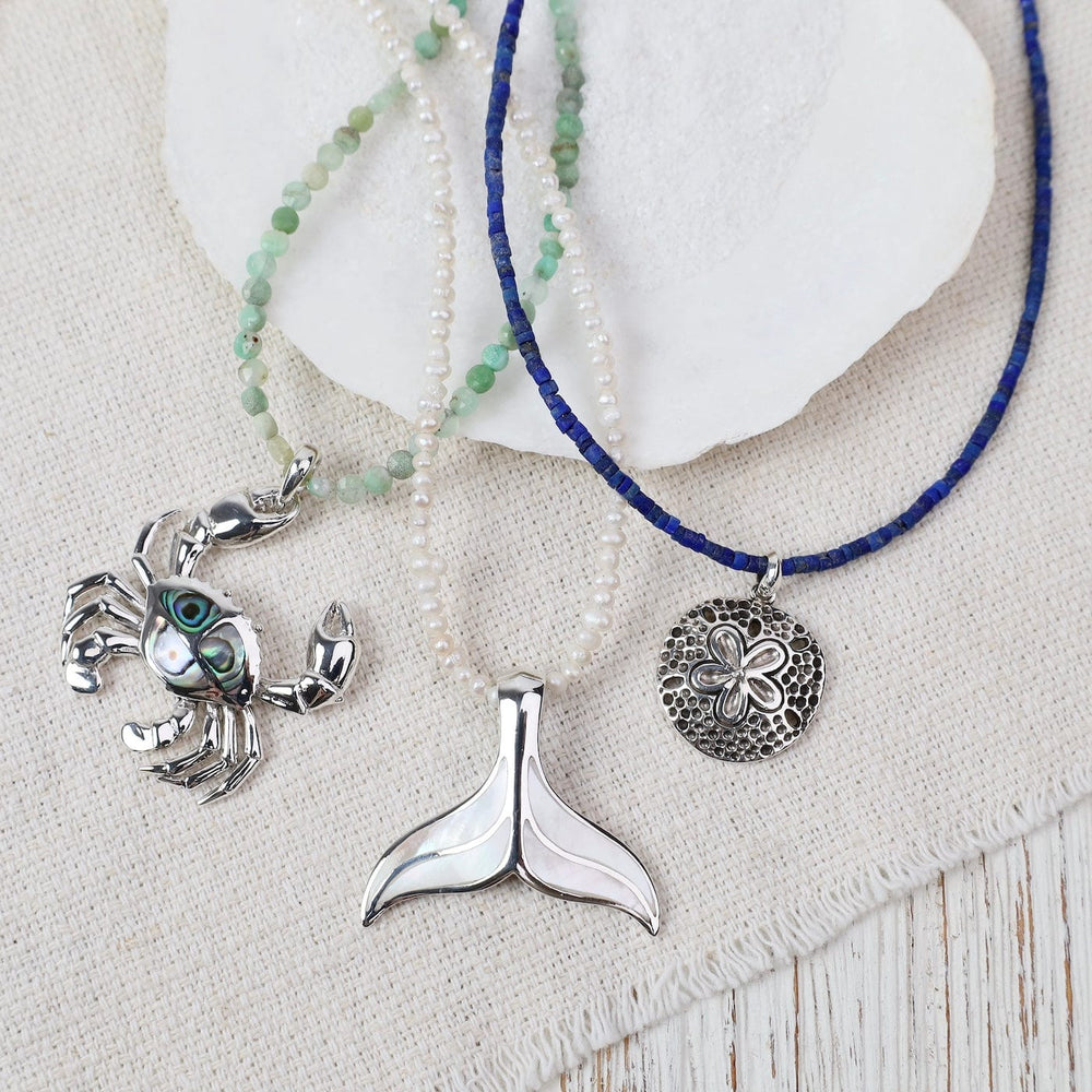 
                  
                    PND Sterling Silver Large Whale Tail with Mother Of Pe
                  
                