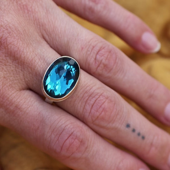 Load and play video in Gallery viewer, Sterling &amp;amp; 14K Gold Ring with Oval Inverted London Blue Topaz
