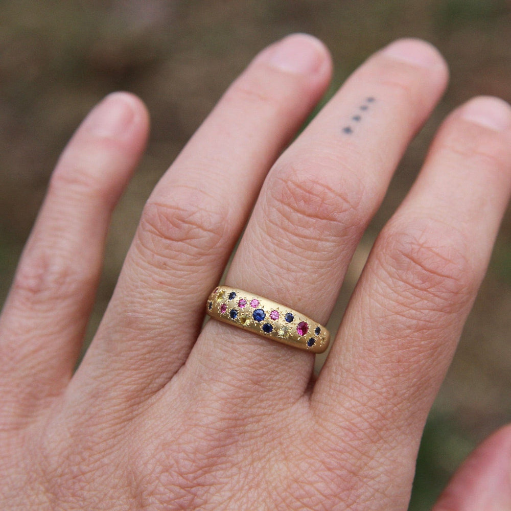 
                      
                        RING-18K Tapered Multi Sapphire Band
                      
                    