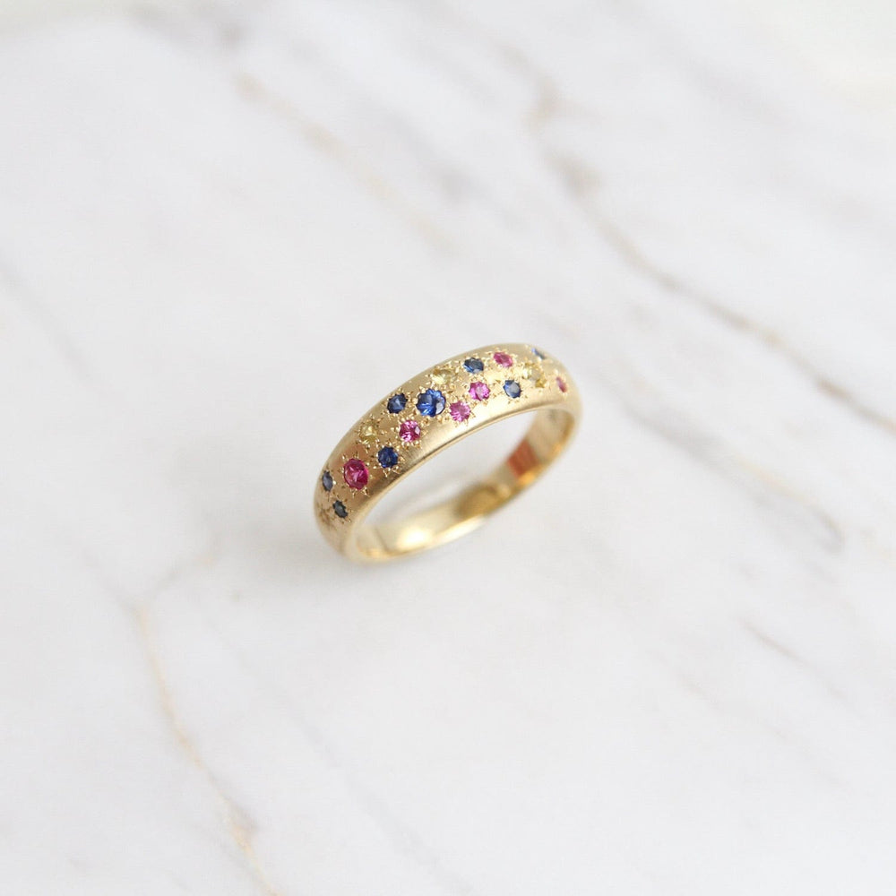 
                      
                        RING-18K Tapered Multi Sapphire Band
                      
                    