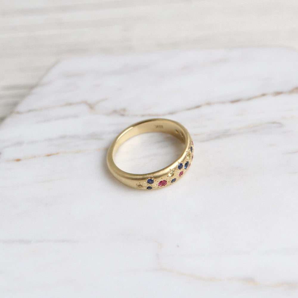 
                      
                        RING-18K Tapered Multi Sapphire Band
                      
                    