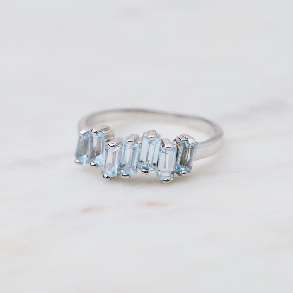 
                  
                    RNG-14K Blue Topaz Half Band Ring
                  
                