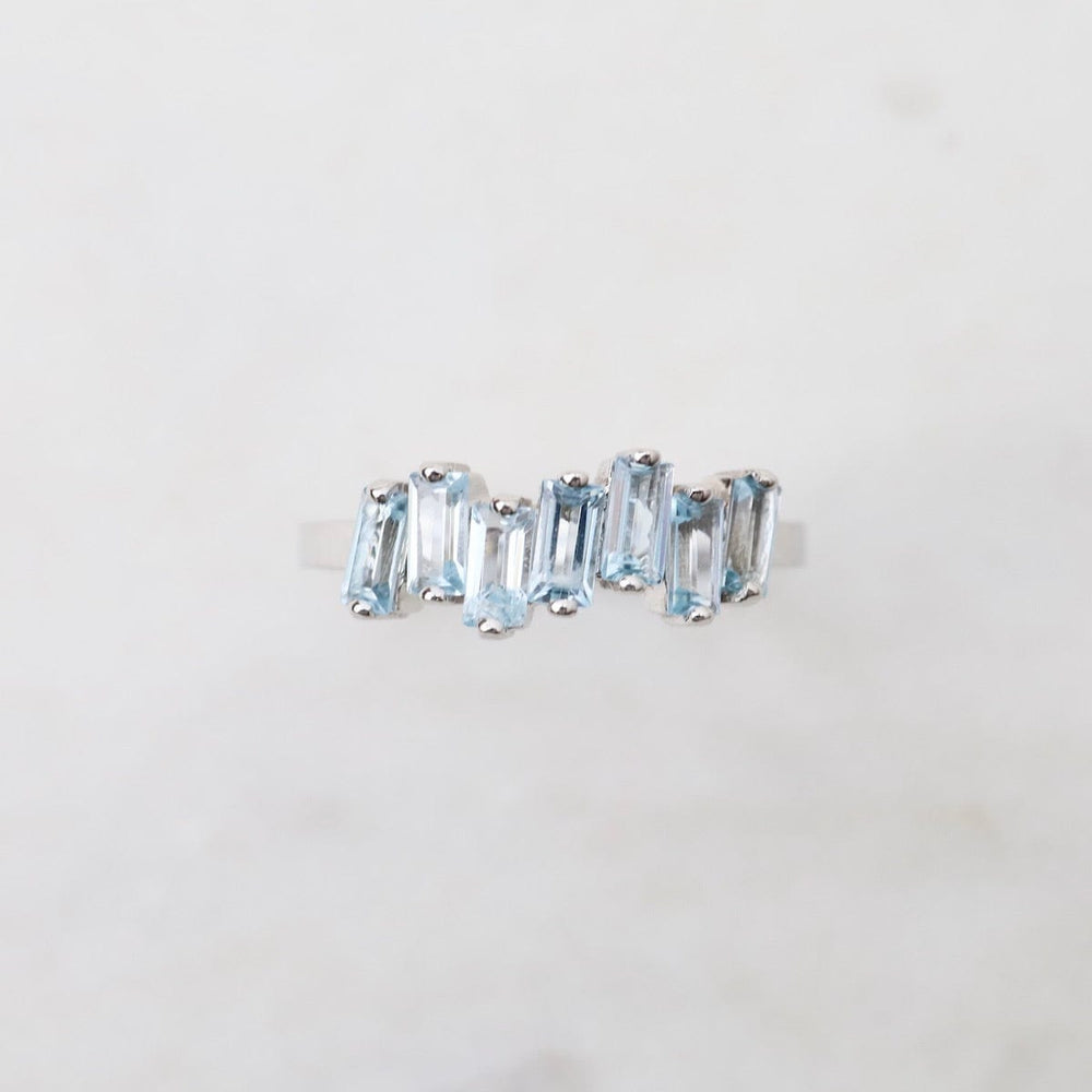 
                  
                    RNG-14K Blue Topaz Half Band Ring
                  
                