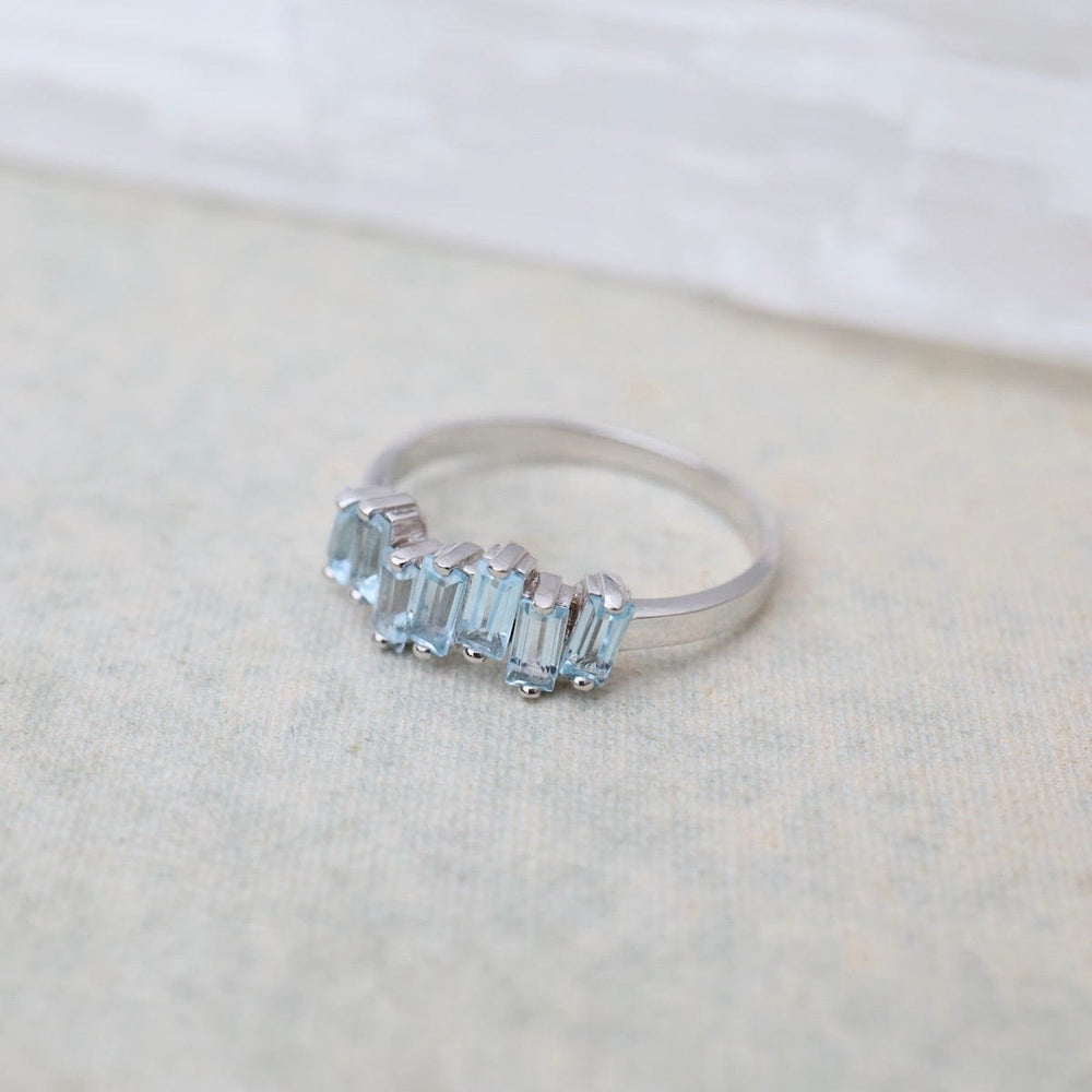 
                  
                    RNG-14K Blue Topaz Half Band Ring
                  
                