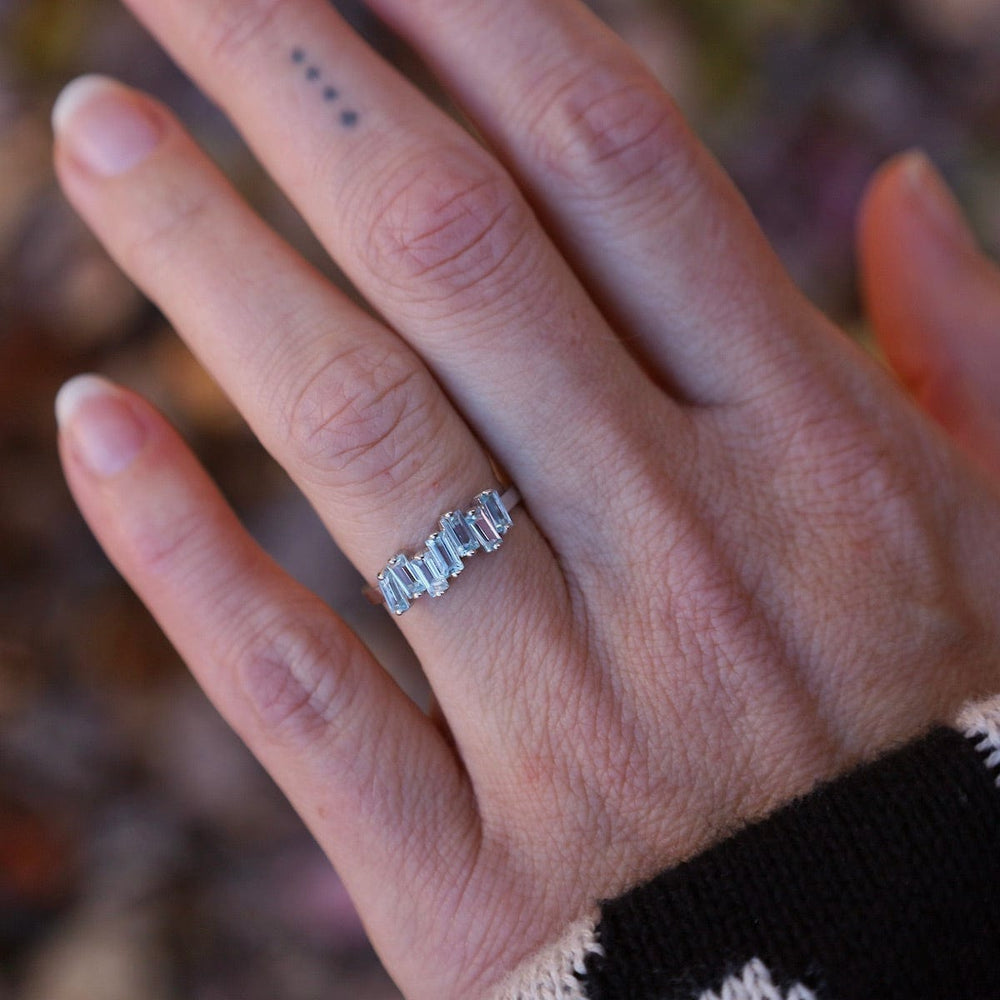 
                  
                    RNG-14K Blue Topaz Half Band Ring
                  
                