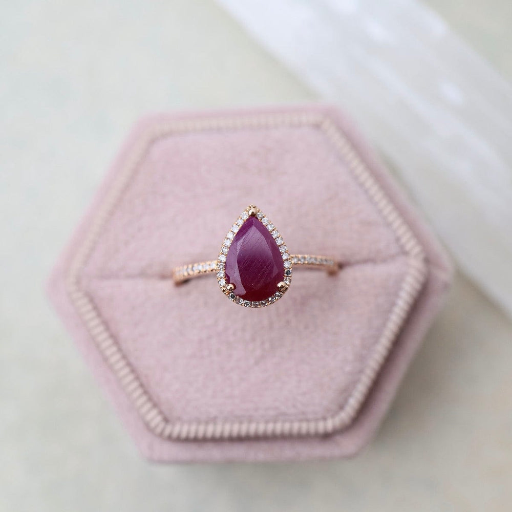 
                      
                        RNG-14K Drop Shape Ruby with White Diamond Halo & Shoulders Ring
                      
                    