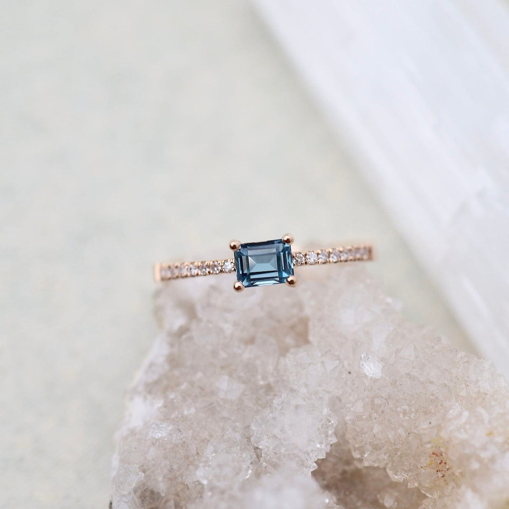 
                      
                        RNG-14K Emerald Cut London Blue Topaz with White Diamond Shoulders Ring
                      
                    