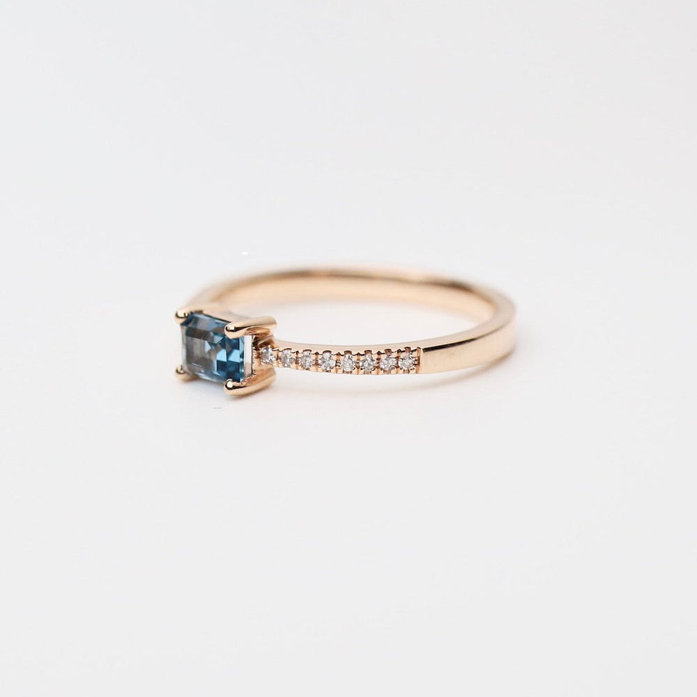 
                      
                        RNG-14K Emerald Cut London Blue Topaz with White Diamond Shoulders Ring
                      
                    