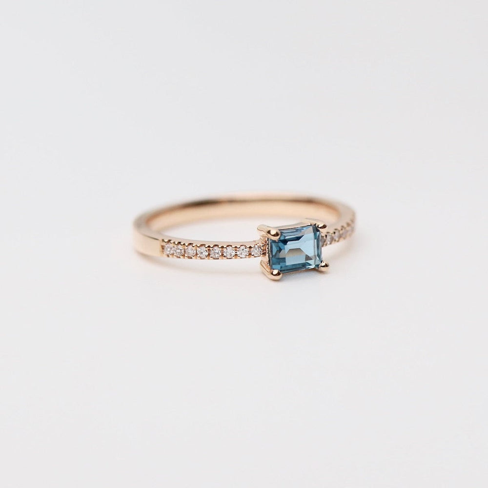 
                      
                        RNG-14K Emerald Cut London Blue Topaz with White Diamond Shoulders Ring
                      
                    