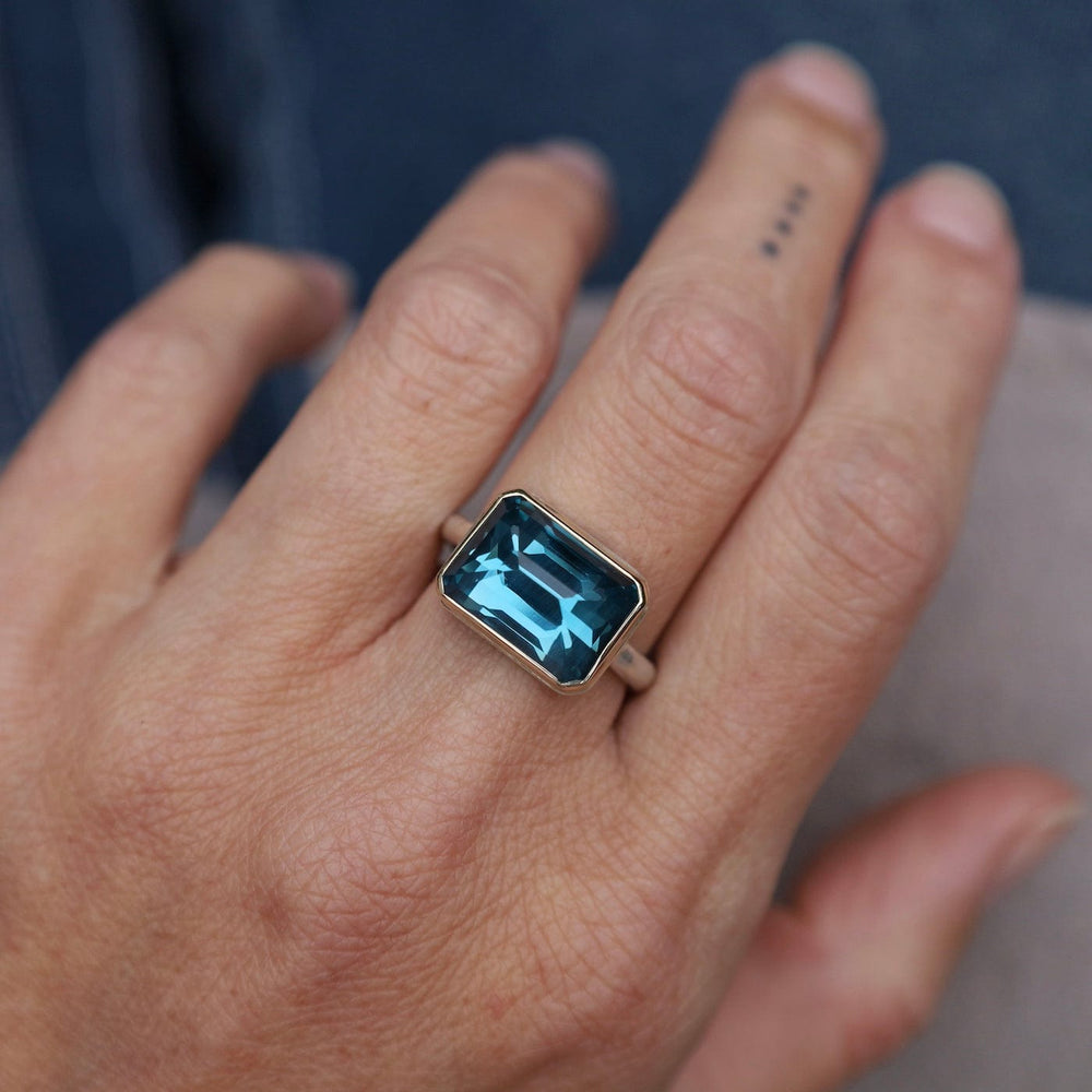 
                      
                        RNG-14K Jamie Joseph Small Rectangular Inverted London Blue Topaz Ring
                      
                    