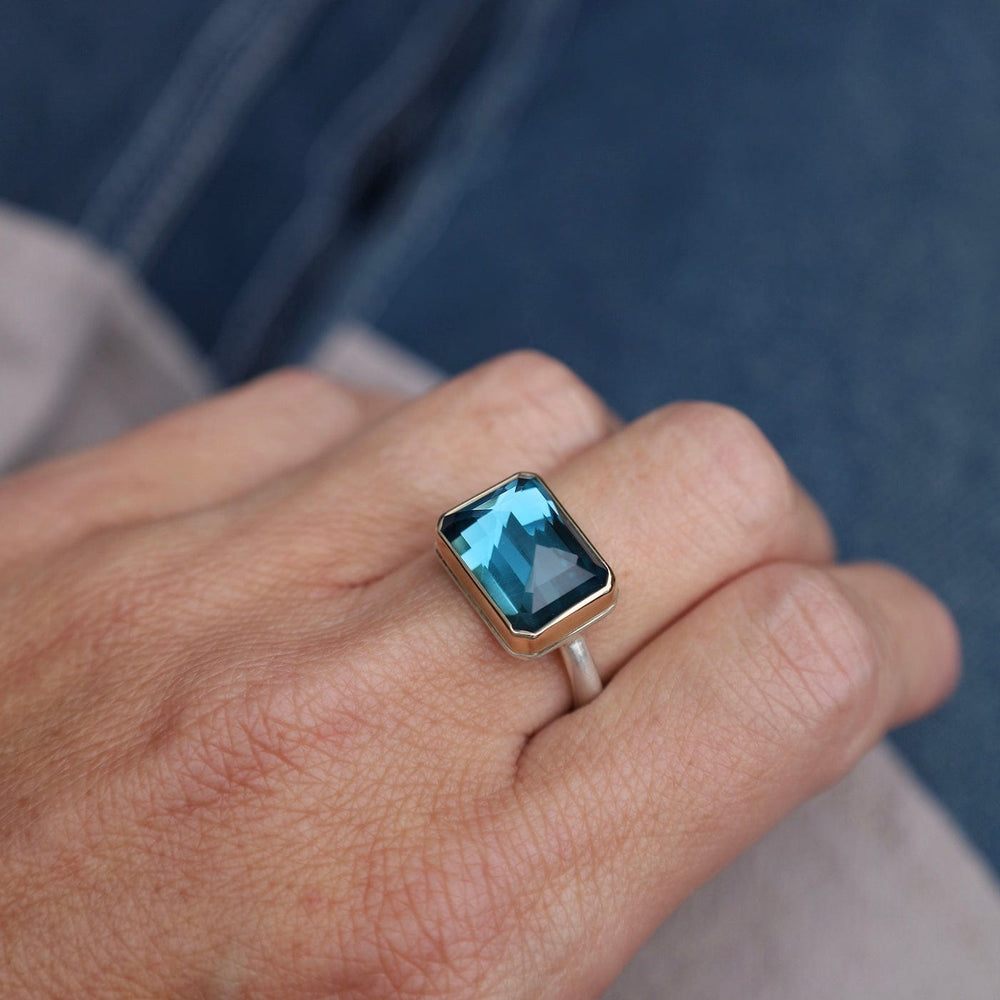 
                      
                        RNG-14K Jamie Joseph Small Rectangular Inverted London Blue Topaz Ring
                      
                    