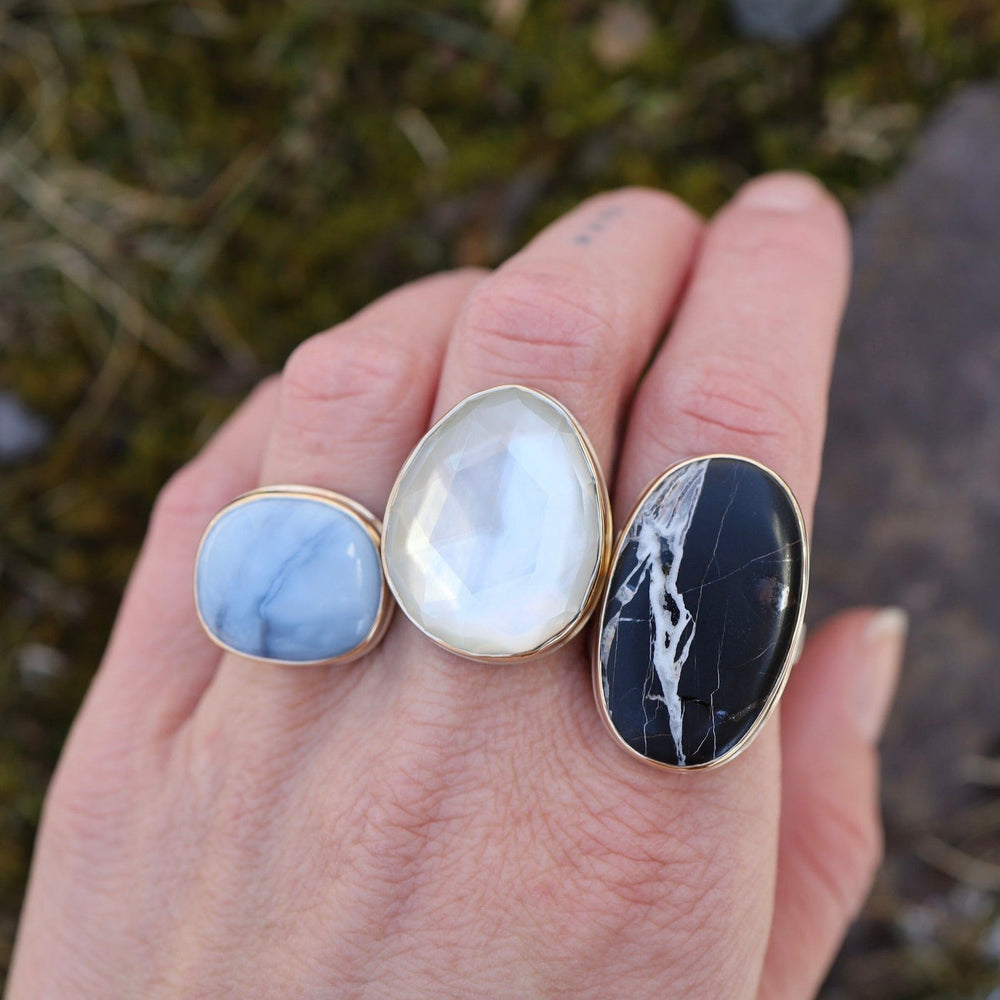 
                      
                        RNG-14K Sterling & 14K Gold Ring with Vertical Oval White Buffalo Turquoise
                      
                    