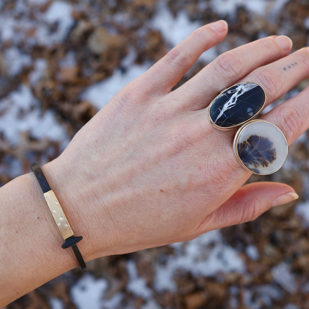 
                      
                        RNG-14K Sterling & 14K Gold Ring with Vertical Oval White Buffalo Turquoise
                      
                    