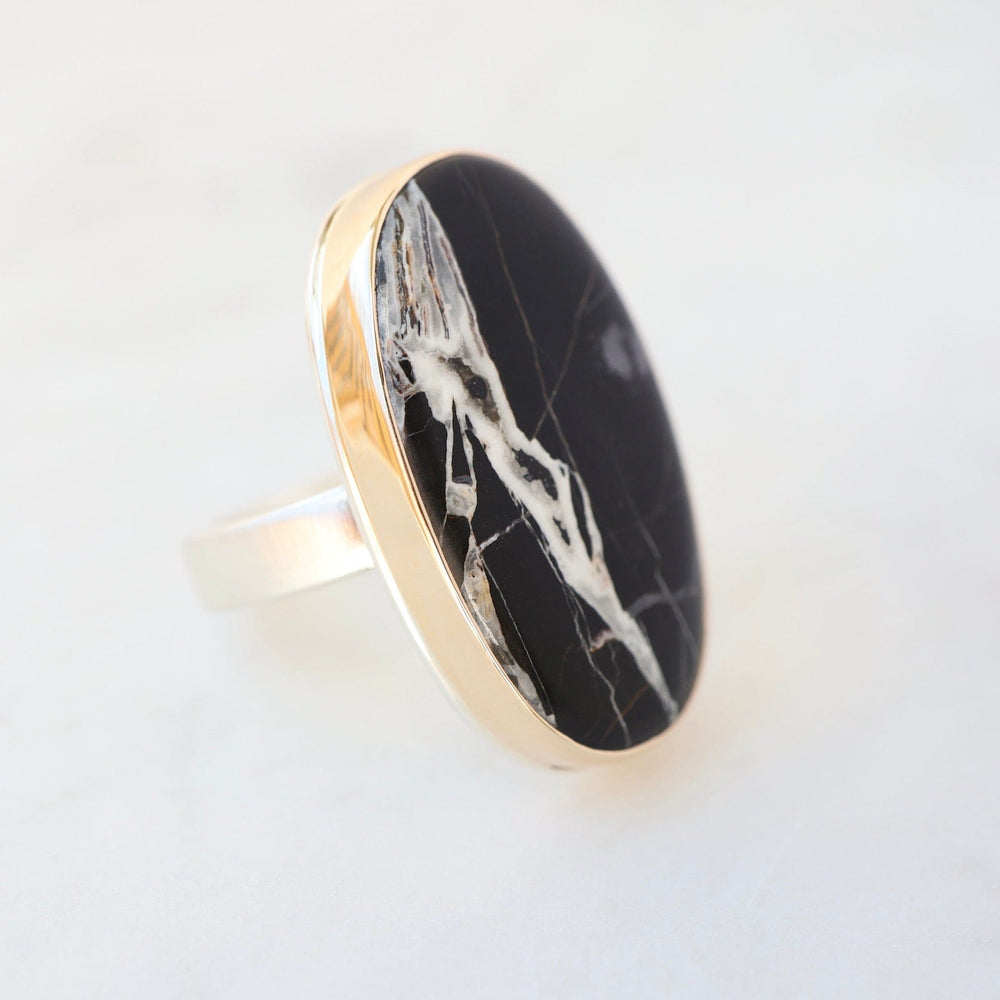 
                      
                        RNG-14K Sterling & 14K Gold Ring with Vertical Oval White Buffalo Turquoise
                      
                    