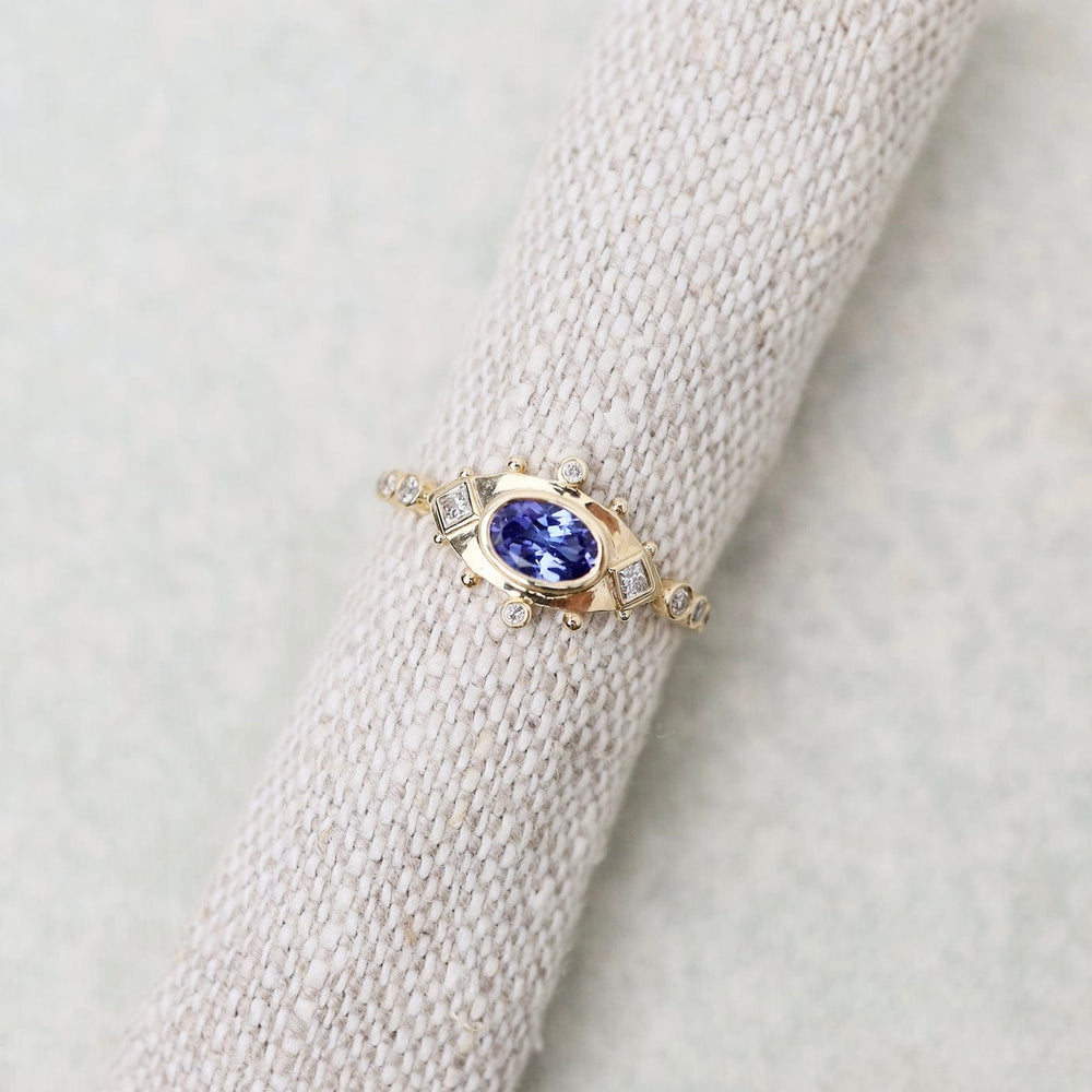 
                      
                        RNG-14K Tanzanite & Diamonds Eye Ring
                      
                    