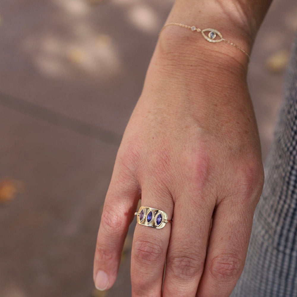 
                      
                        RNG-14K Triple Marquise Tanzanite Solid Gold Plate Ring
                      
                    