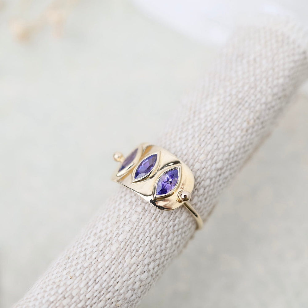 
                  
                    RNG-14K Triple Marquise Tanzanite Solid Gold Plate Ring
                  
                