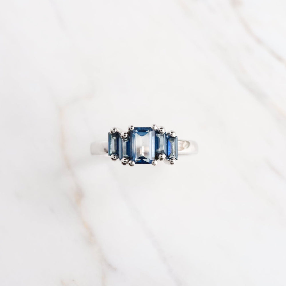 RNG-14K White Gold English Blue Topaz Baguette Ring