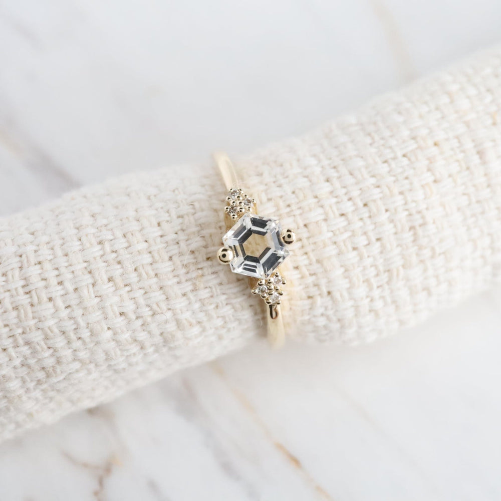 
                  
                    325 RNG-14K Yellow Gold White Topaz Hexagon Ring
                  
                