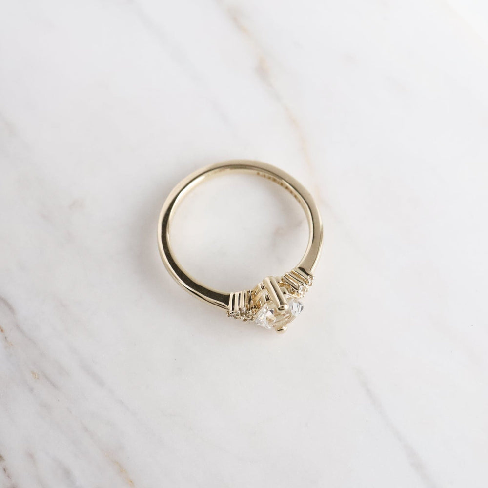 
                  
                    325 RNG-14K Yellow Gold White Topaz Hexagon Ring
                  
                