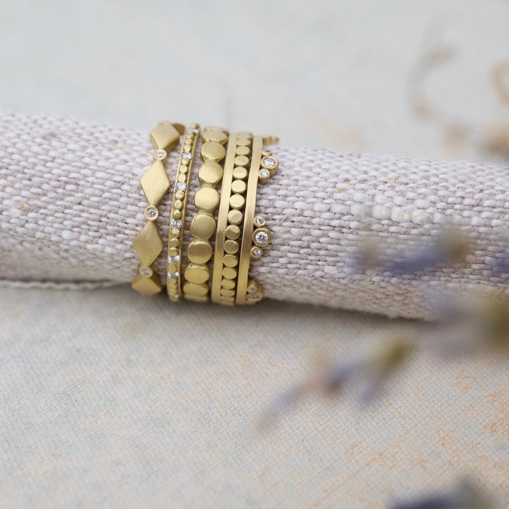 
                      
                        RNG-18K 18k Gold Hammered Dot Stacking Band
                      
                    