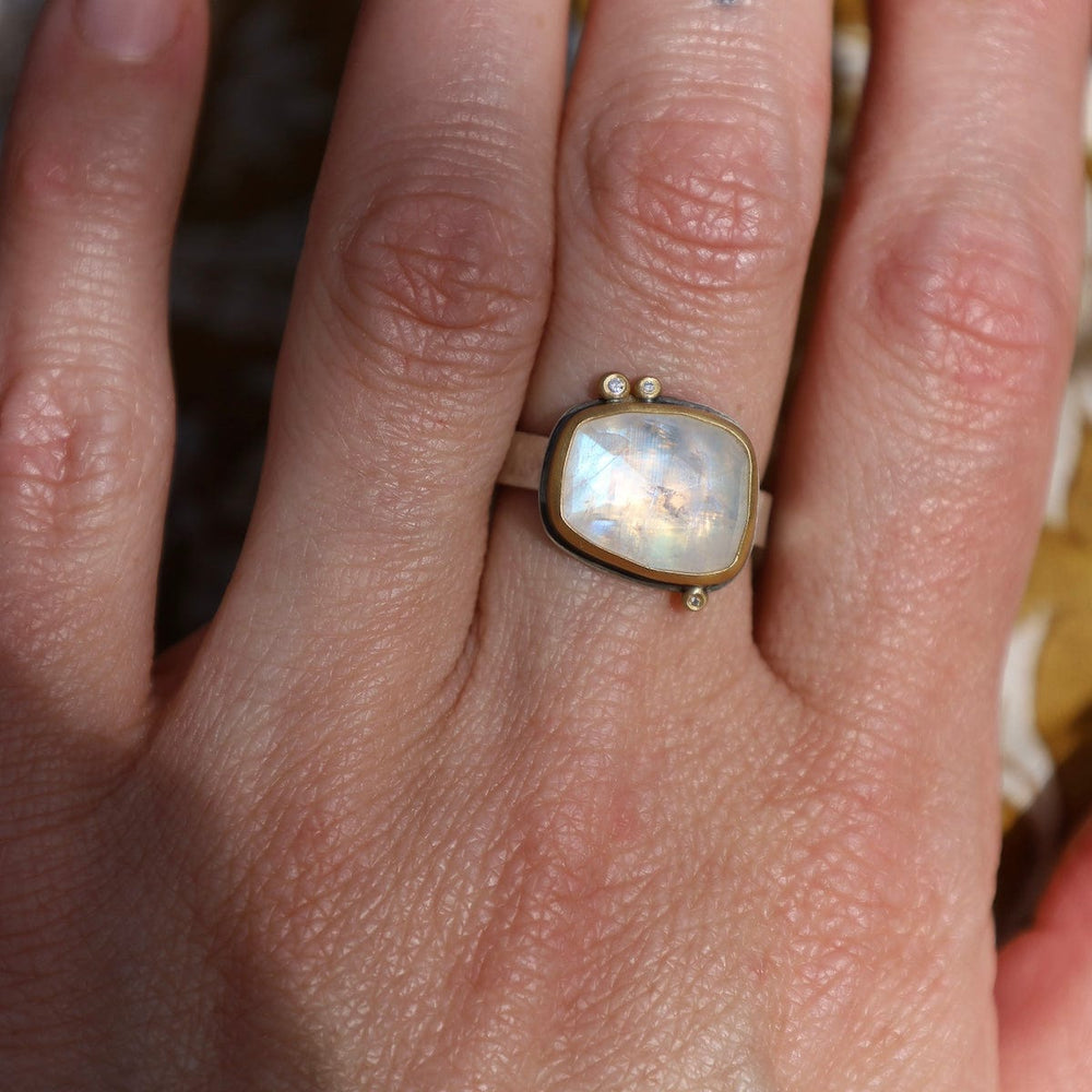 
                      
                        RNG-22K 22k Bezel Set Rosecut Moonstone Ring with 3 Diamonds
                      
                    