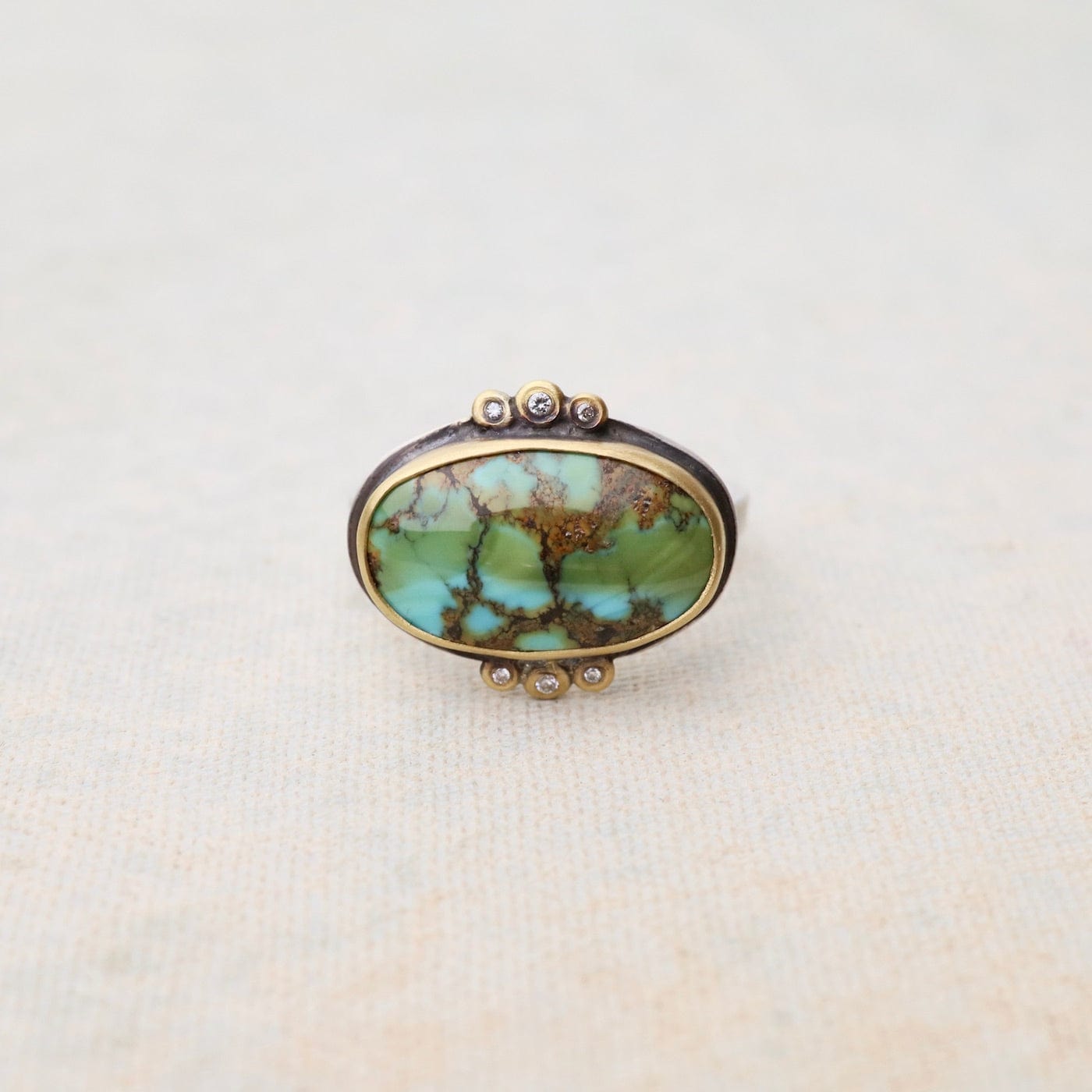 RNG-22K Bezel Set Horizontal Oval Turquoise with Diamond Trios Ring