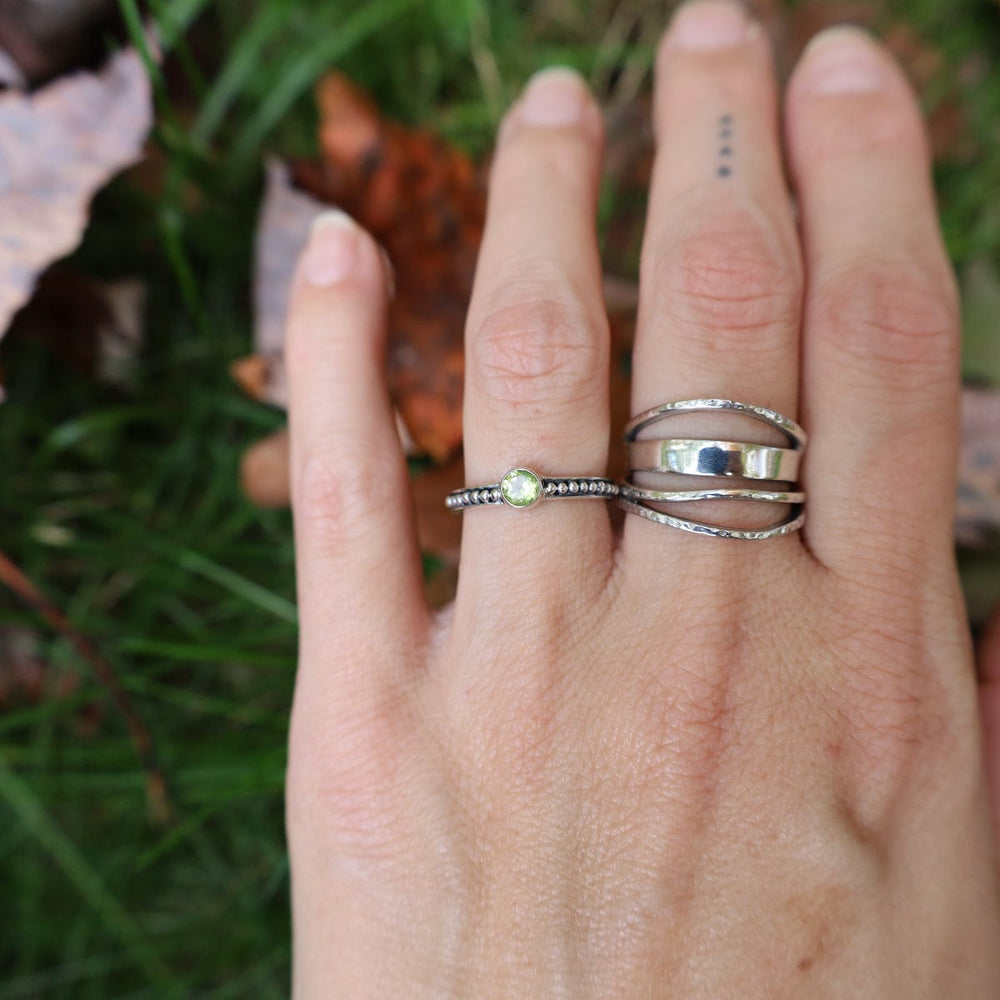 
                      
                        RNG Abstract Sterling Silver Ring with Mixed Textures
                      
                    