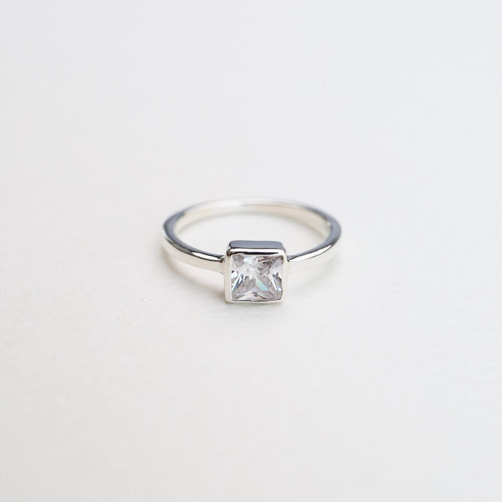 
                      
                        RNG Bezel Set Square CZ Silver Ring
                      
                    