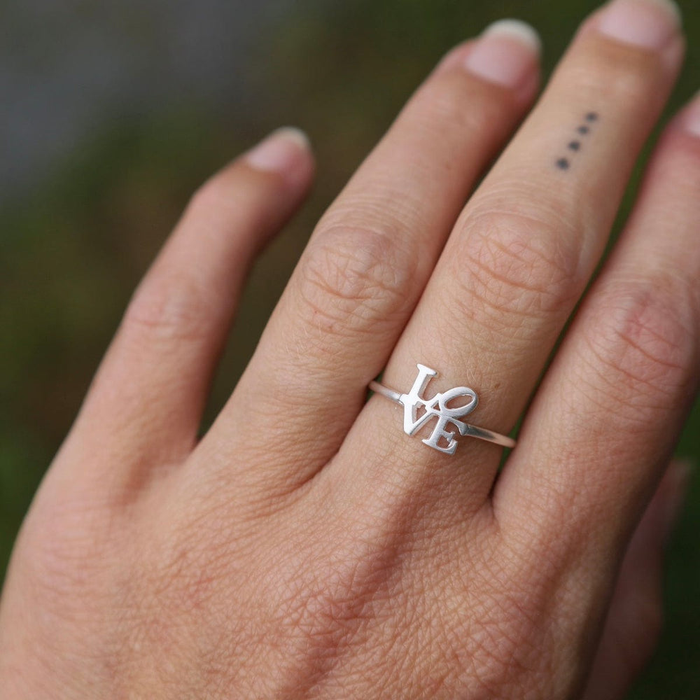 
                      
                        RNG Brushed Sterling Silver Mini LOVE Ring
                      
                    