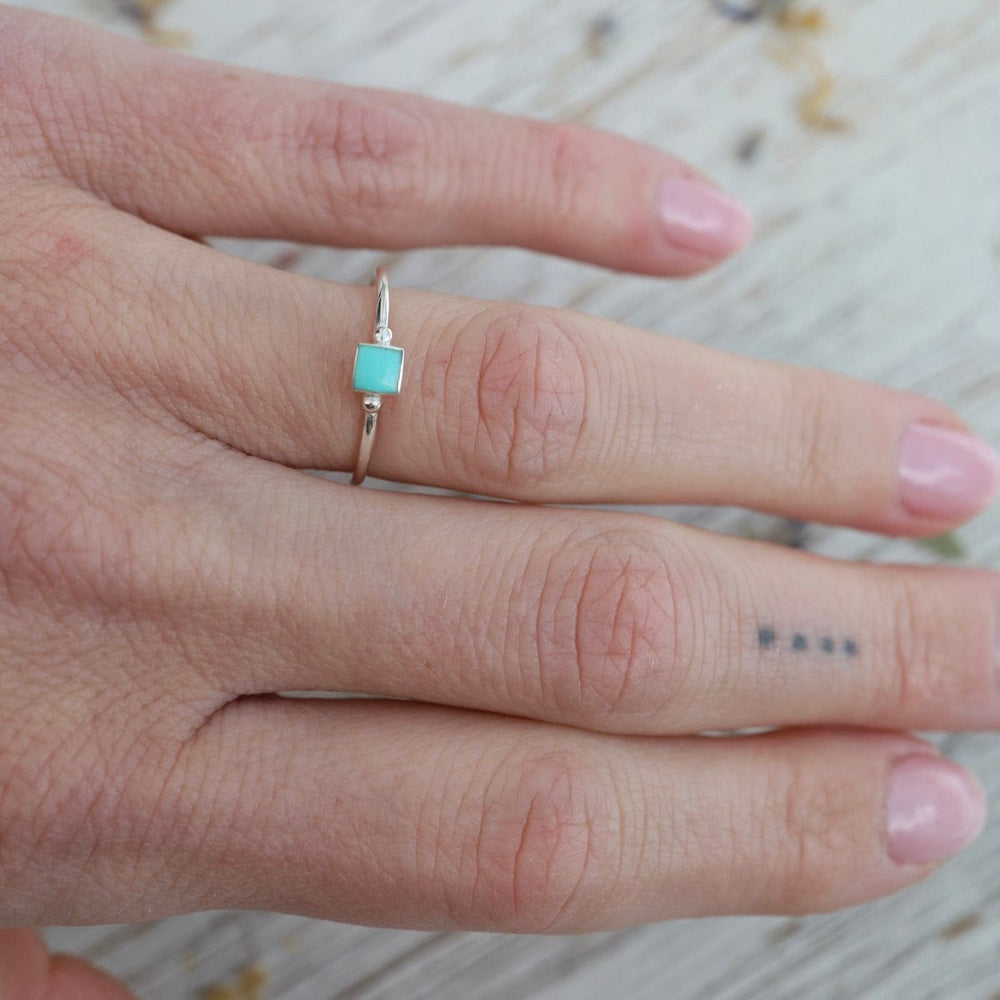 
                      
                        RNG Delicate Compressed Turquoise Square Silver Ring
                      
                    