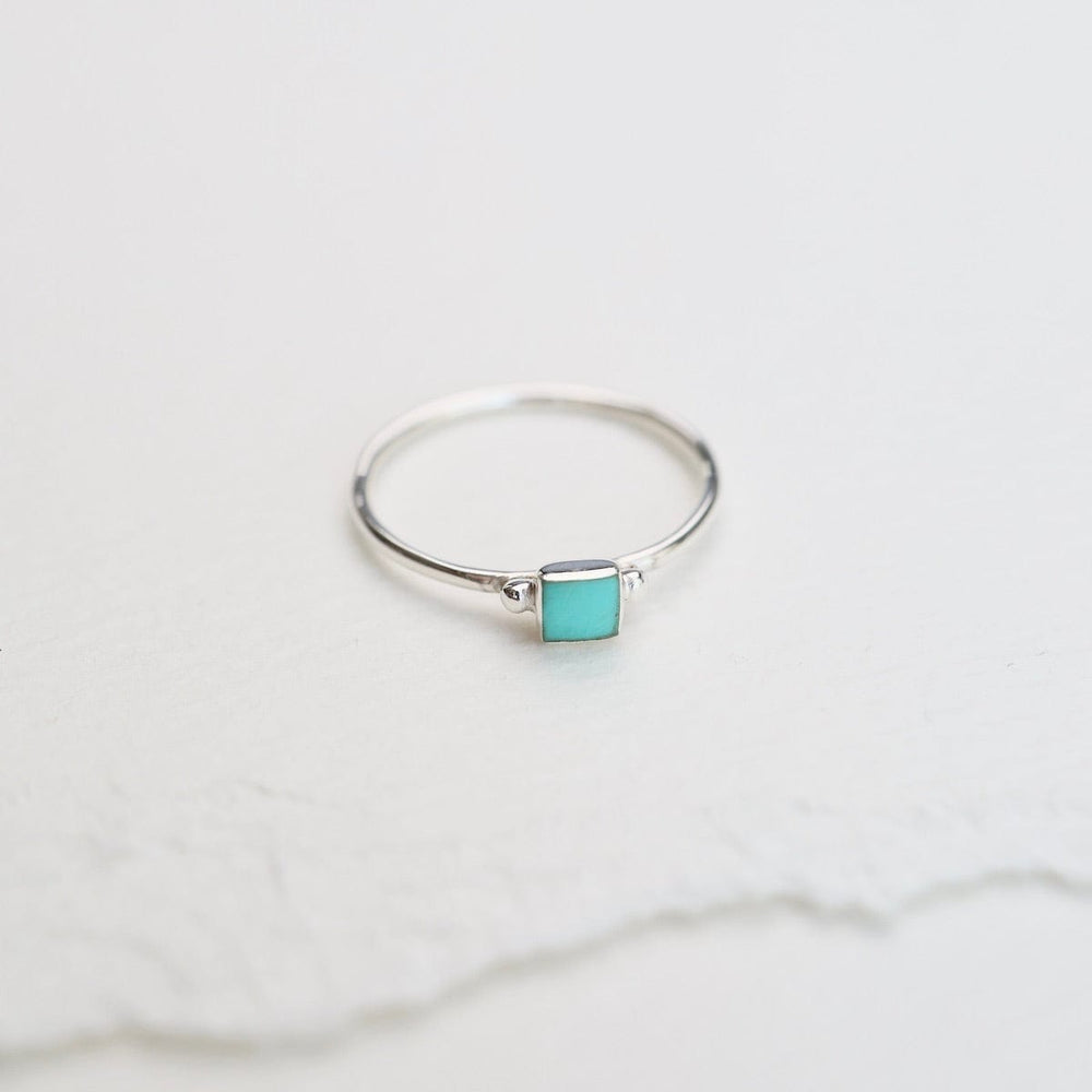 
                      
                        RNG Delicate Compressed Turquoise Square Silver Ring
                      
                    