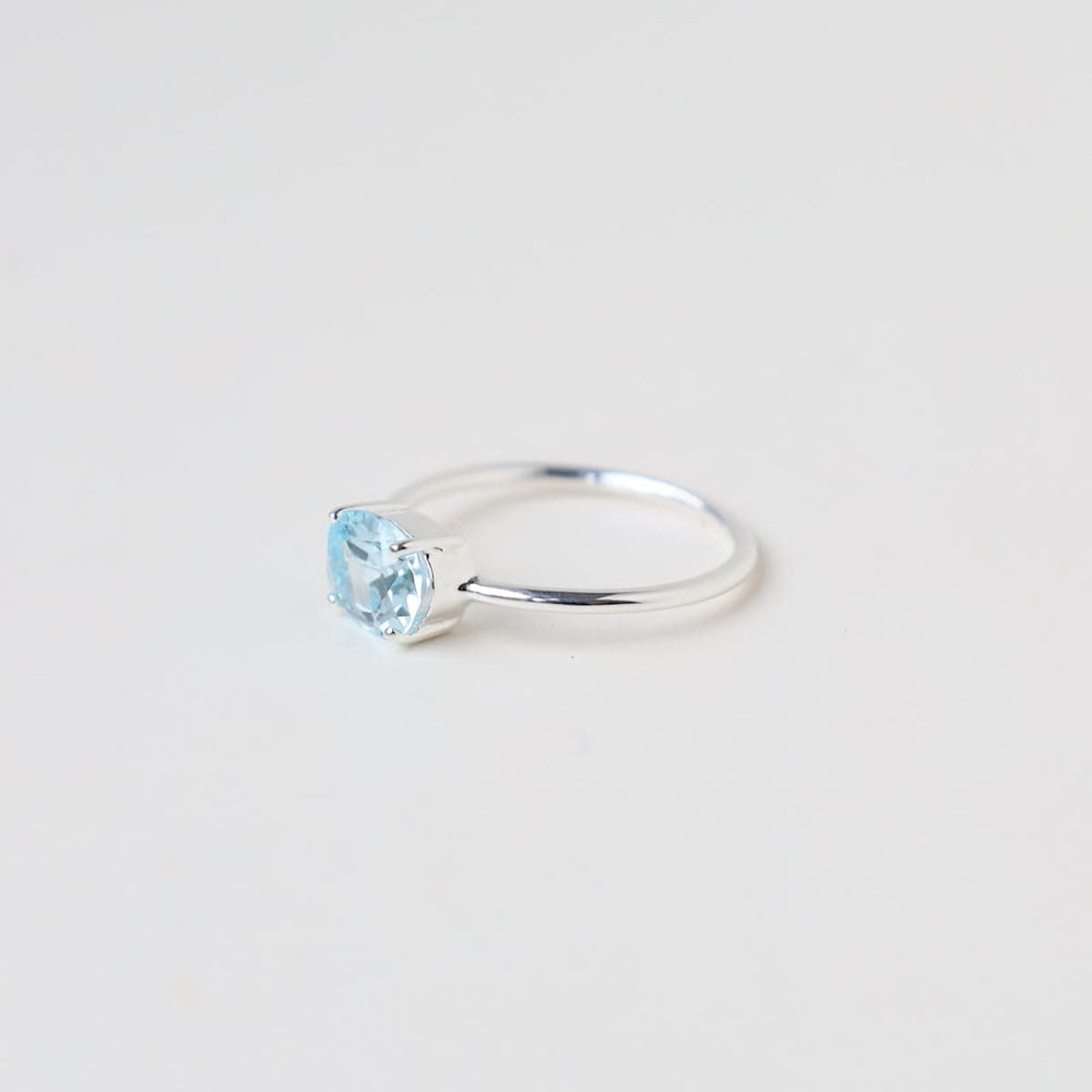 
                      
                        RNG East West Prong Set Oval Sky Blue Topaz Ring
                      
                    