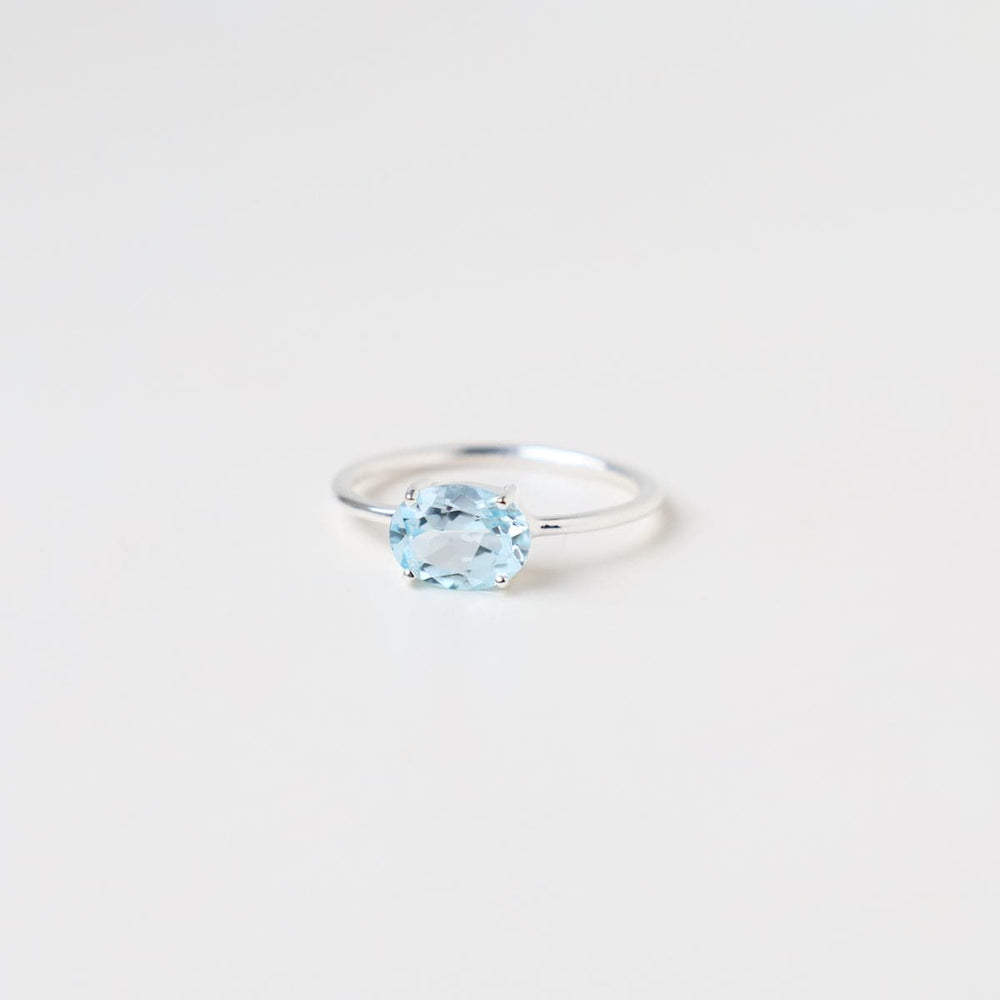 RNG East West Prong Set Oval Sky Blue Topaz Ring