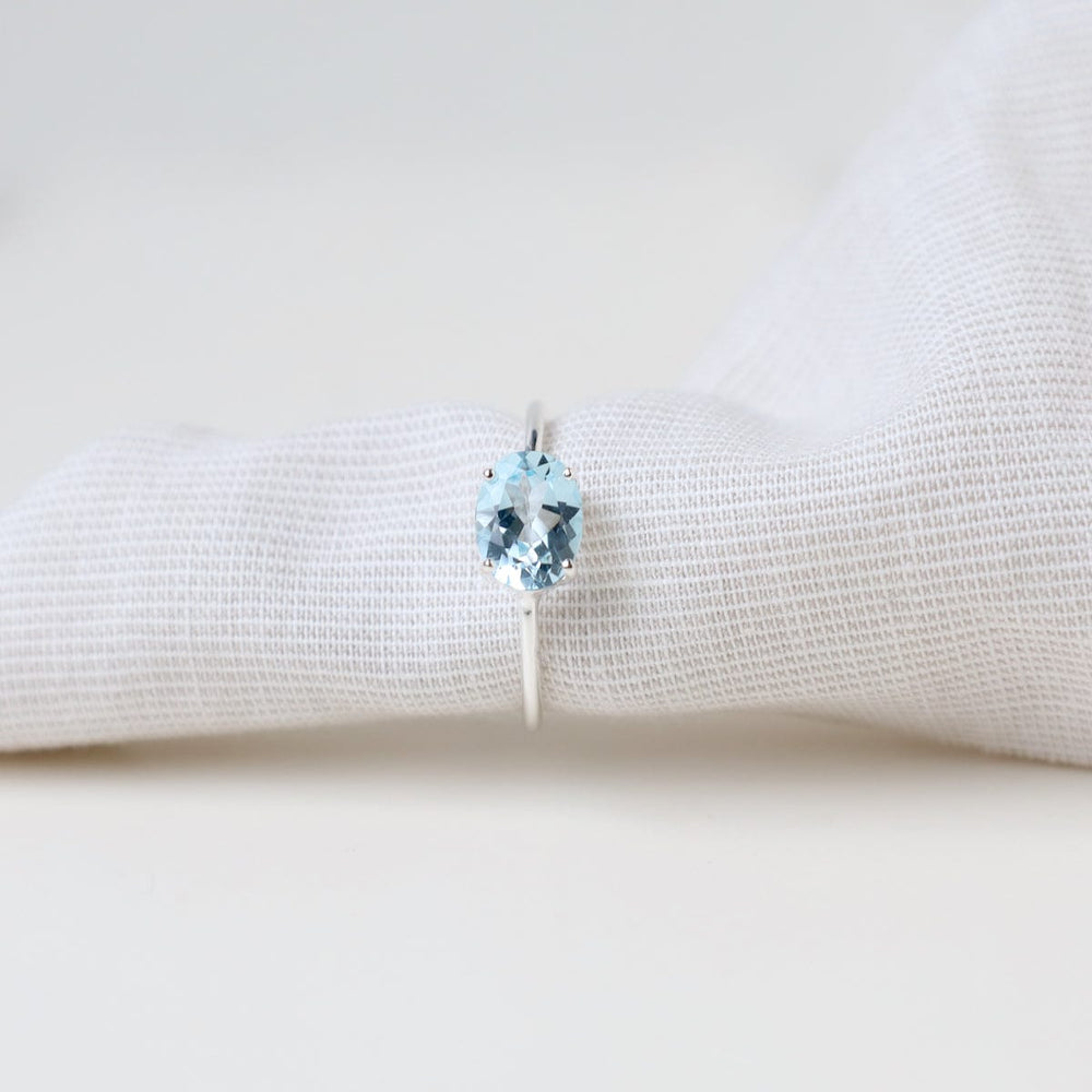 
                      
                        RNG East West Prong Set Oval Sky Blue Topaz Ring
                      
                    