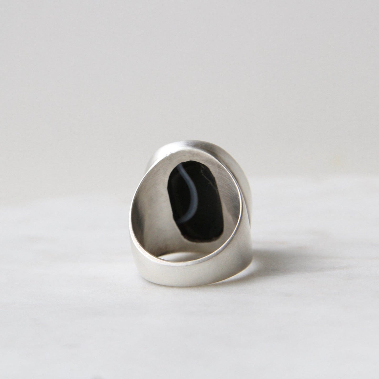 Load image into Gallery viewer, RNG Large Oval Flat Cut Banded Black Onyx Ring
