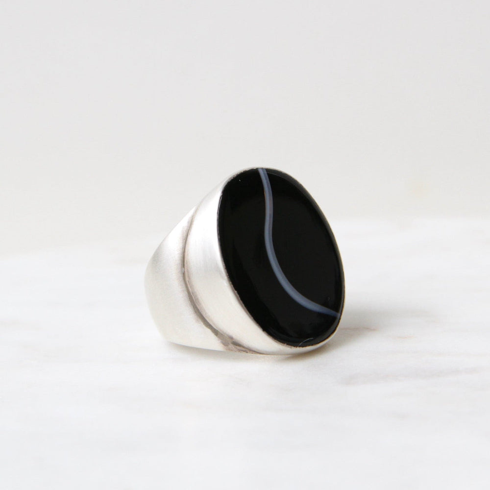 
                      
                        RNG Large Oval Flat Cut Banded Black Onyx Ring
                      
                    