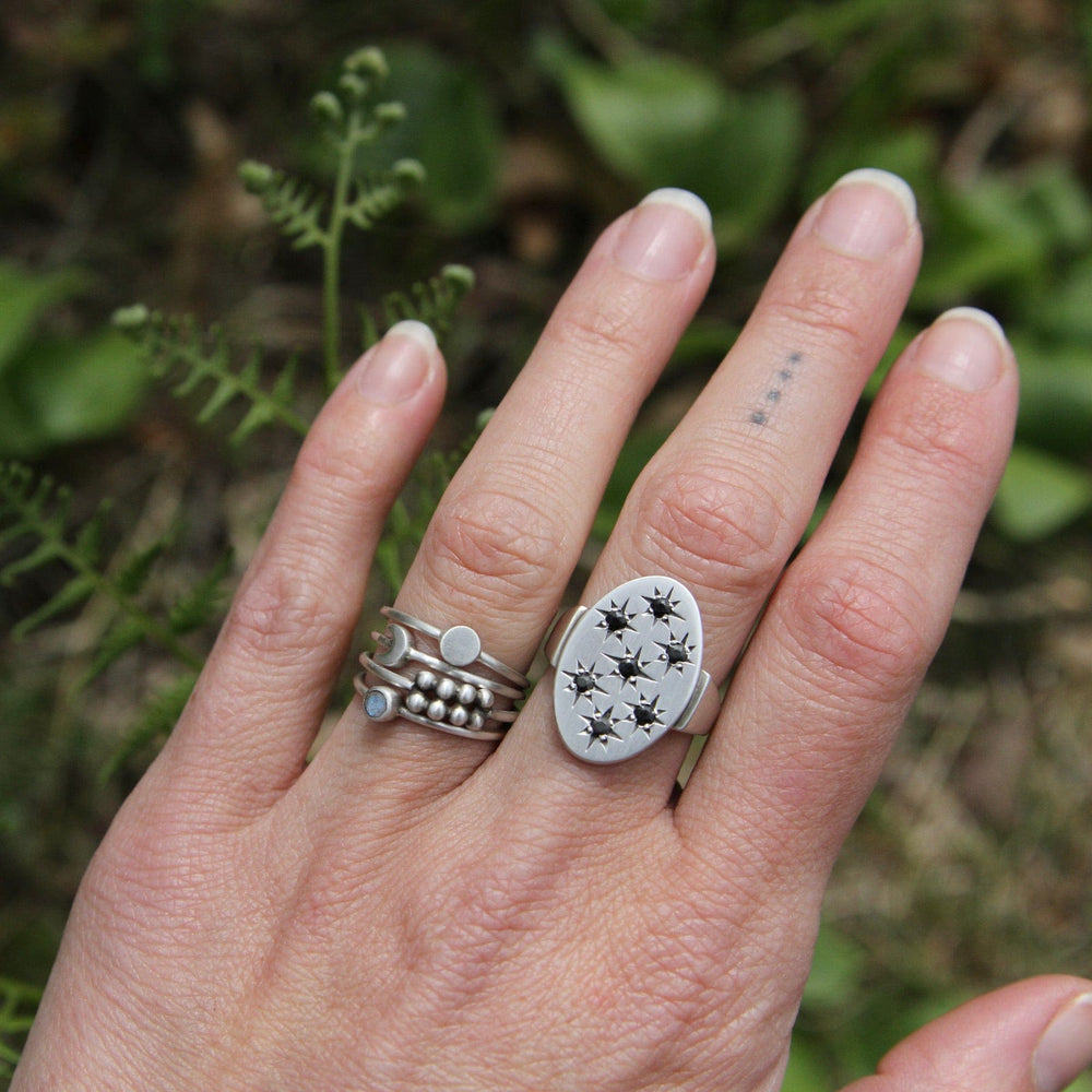 
                      
                        RNG Large Oval with 7 Star Set Black Onyx Ring
                      
                    