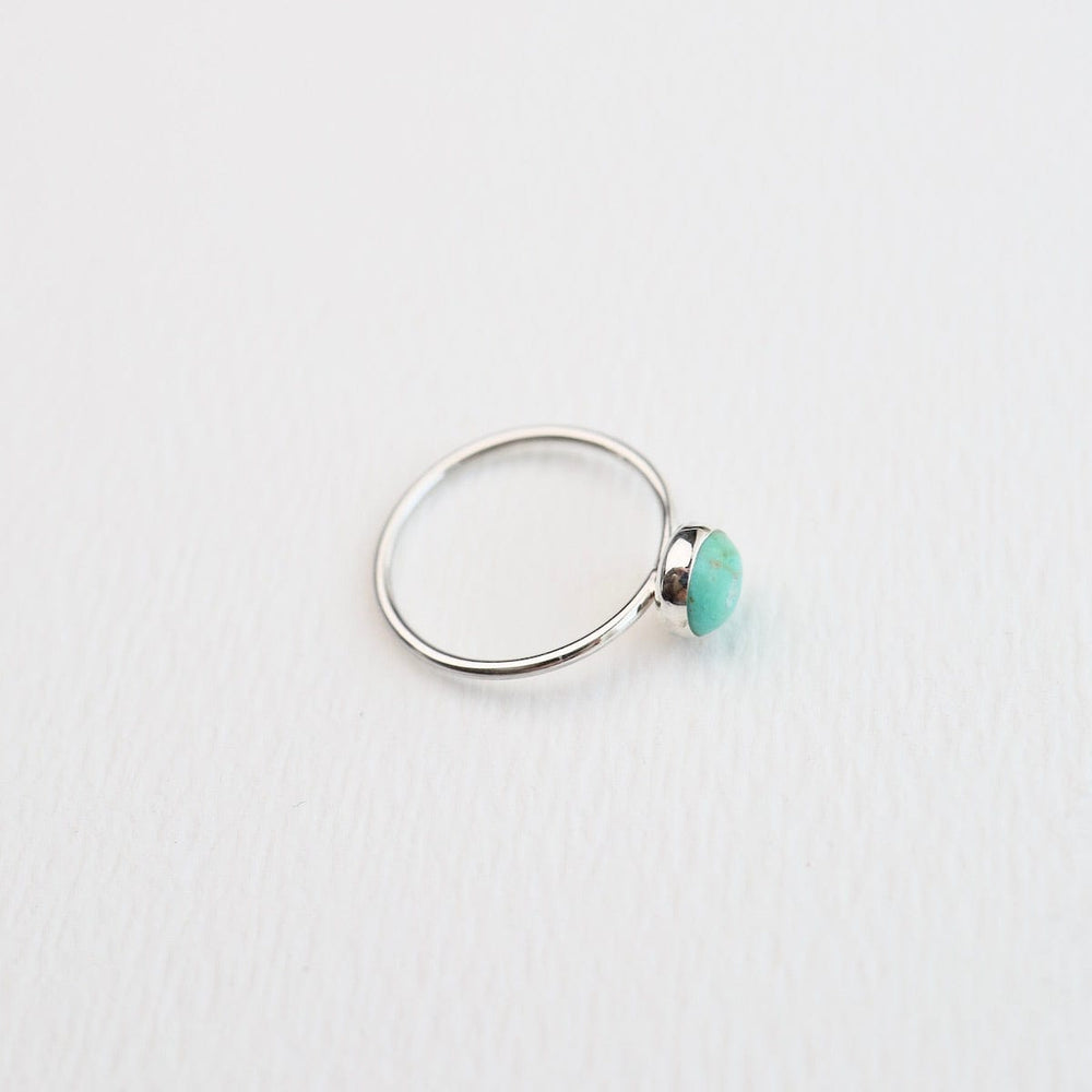 
                  
                    RNG Round Compressed Turquoise Silver Ring
                  
                