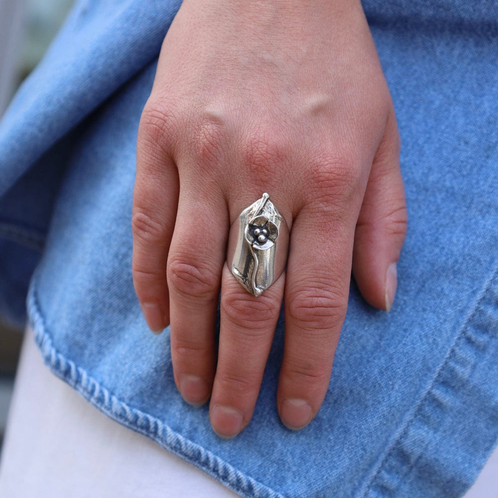 
                      
                        RNG Shield Ring with Dogwood Flower
                      
                    