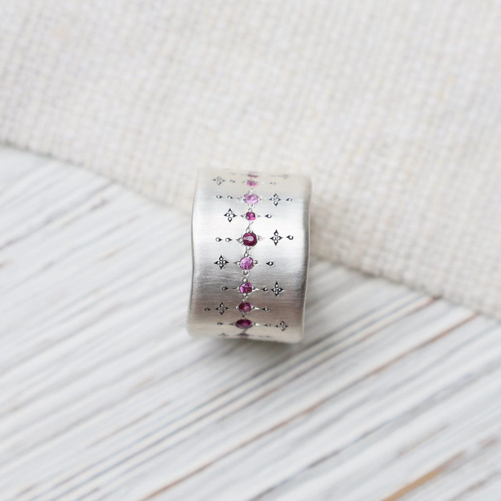 
                      
                        RNG Single Organic Wide Band in Pink Sapphire & Ruby
                      
                    