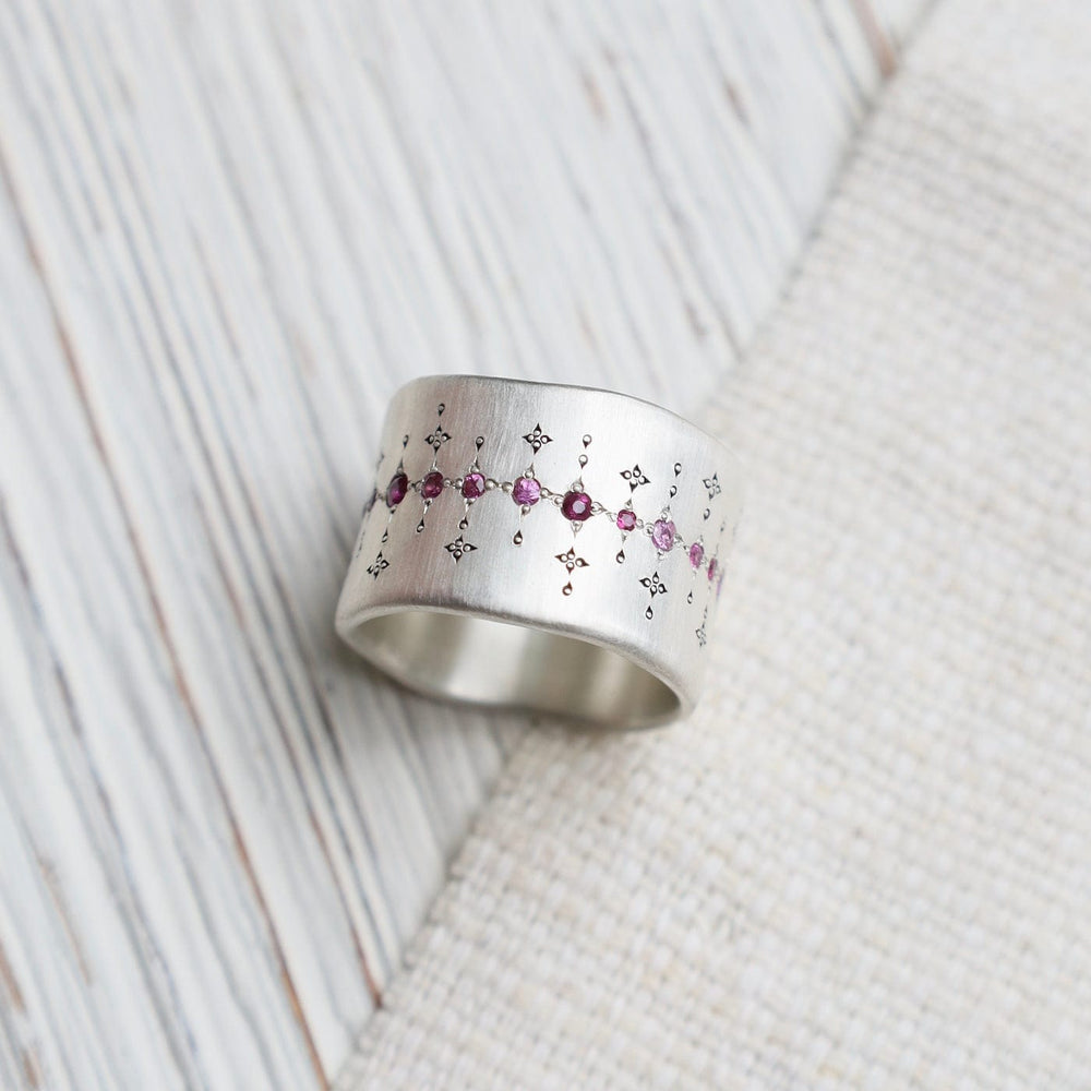 
                      
                        RNG Single Organic Wide Band in Pink Sapphire & Ruby
                      
                    