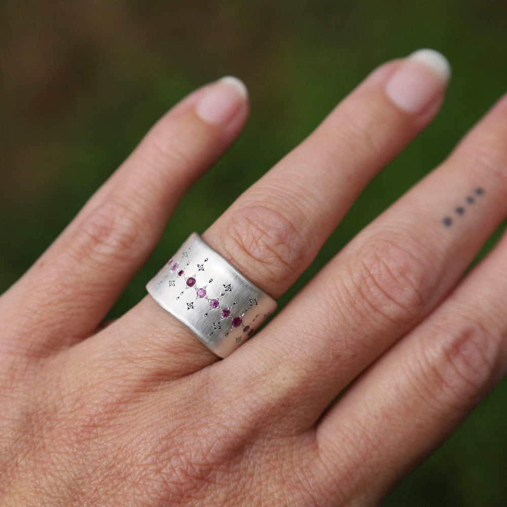 
                      
                        RNG Single Organic Wide Band in Pink Sapphire & Ruby
                      
                    