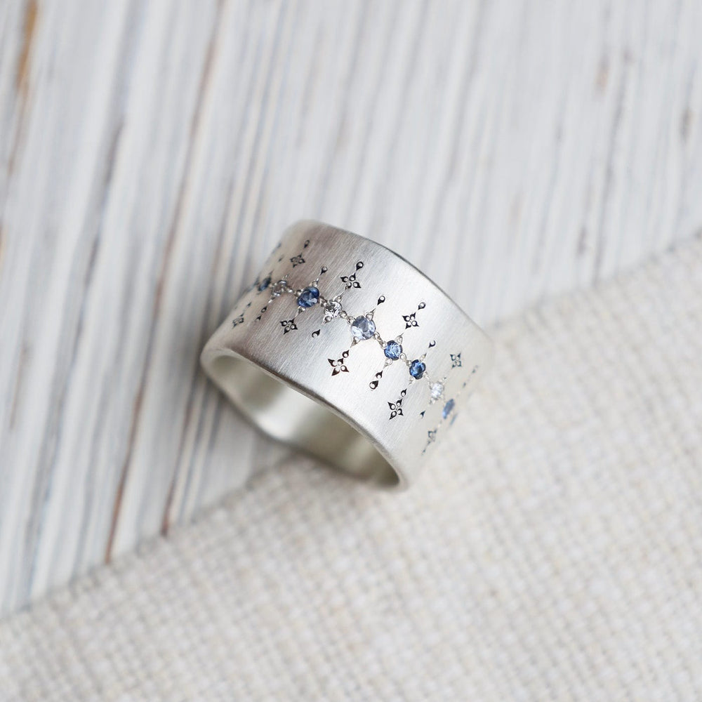 
                      
                        RNG Single Organic Wide Band in Sapphire, Aquamarine & Diamond
                      
                    