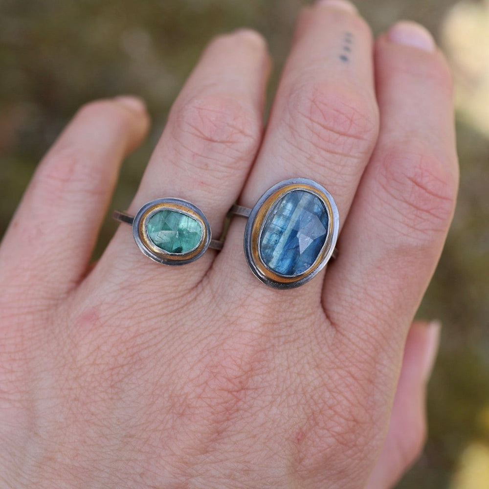 
                      
                        RNG Small Oval Crescent Rim Ring - Green Kyanite
                      
                    