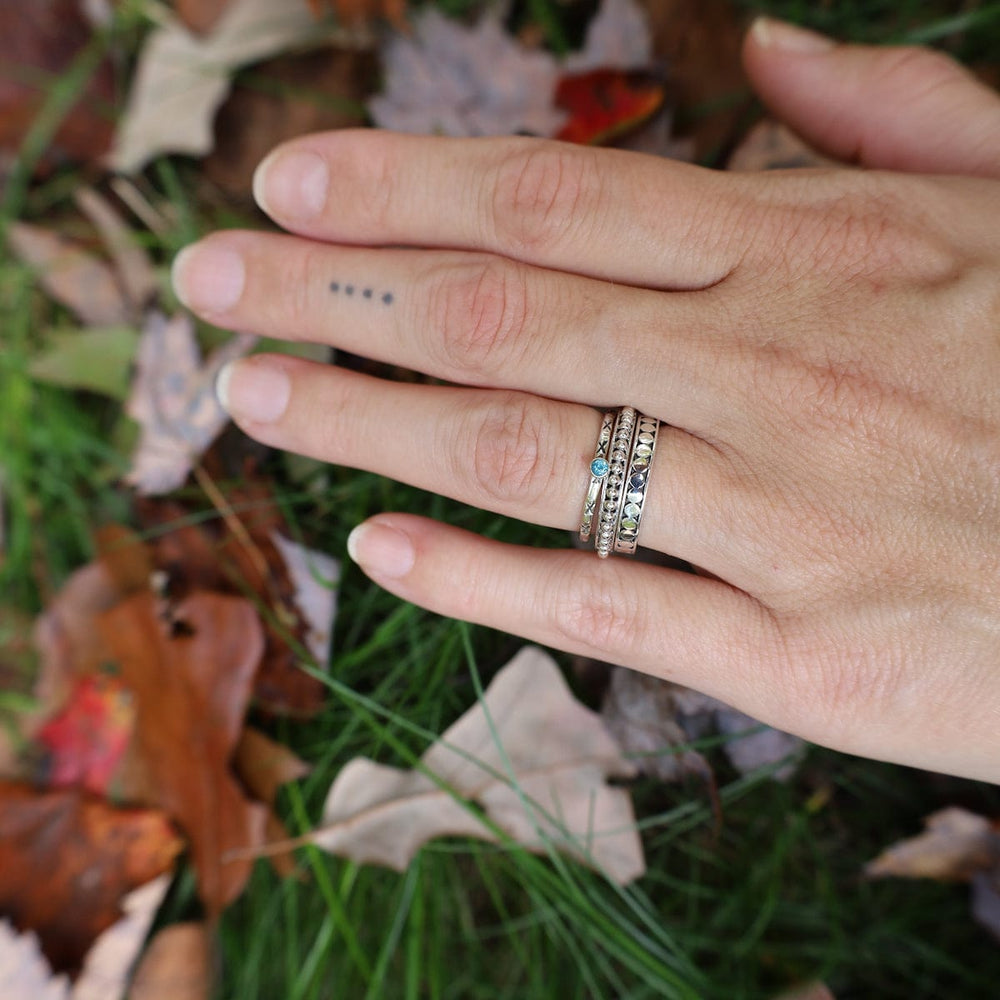 
                  
                    RNG Sterling Etched Stacking Ring with Blue Topaz
                  
                