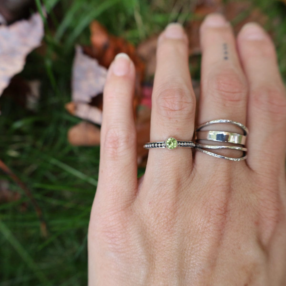 
                  
                    RNG Sterling Silver Granulation Band with Peridot
                  
                