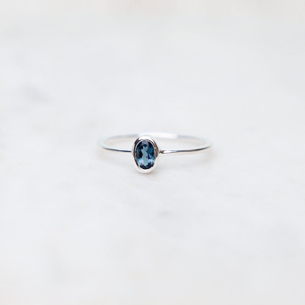 
                      
                        RNG Sterling Silver Oval Bezel Set London Blue Topaz Ring
                      
                    